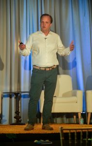 Man Speaking on Stage