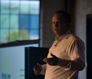 Tucker Speaking on Stage