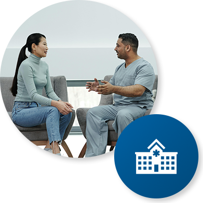 Hospital Industry Icon - Patient Care two people talking